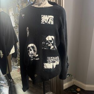 Edgy Black Sweater with Skull Accents